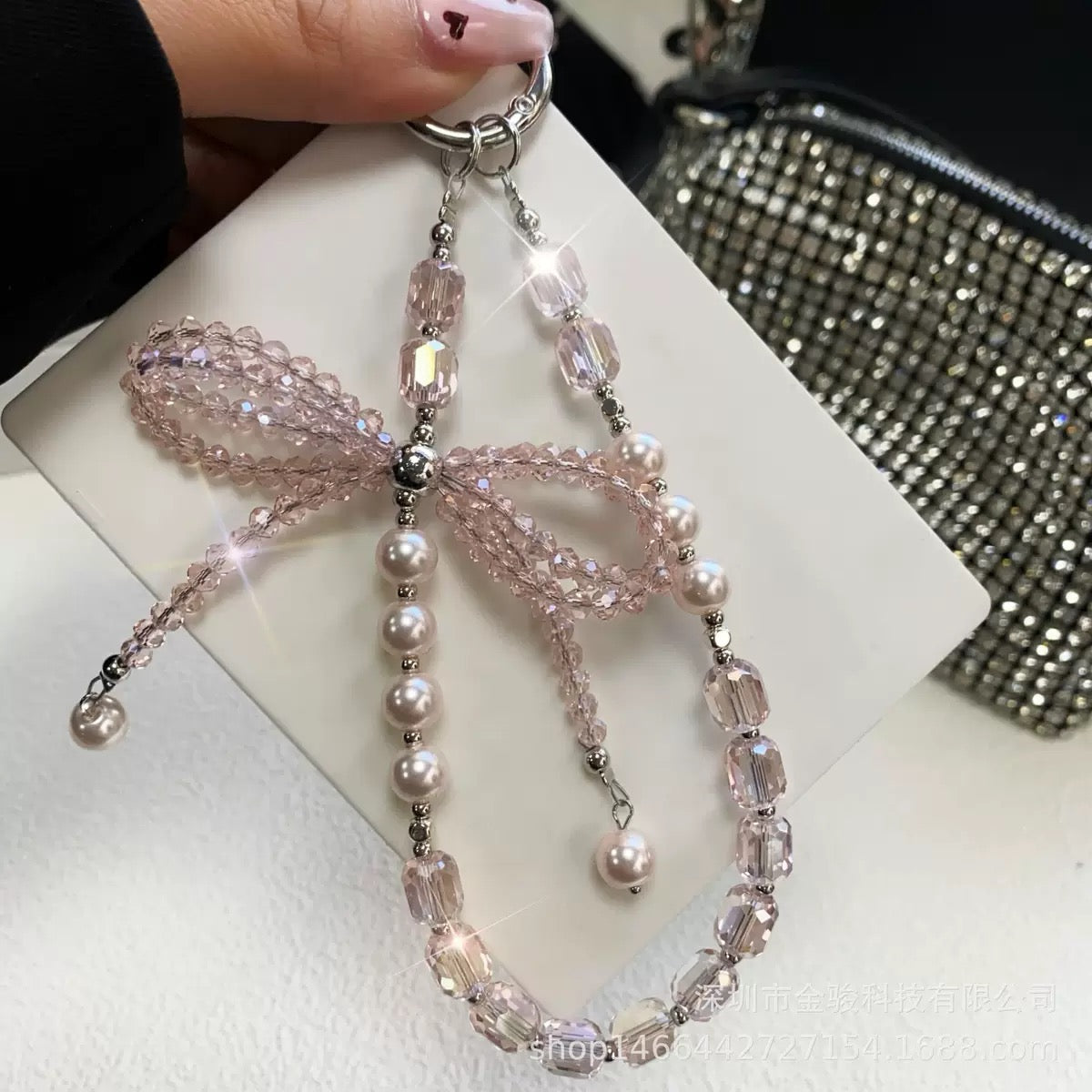 This version positions the product as an ideal gift solution with elegant packaging for special occasions.  Elegant Crystal Bow Phone Chain Gift Set - Luxury Rhinestone Accessory with Detachable Bracelet, Perfect Purse Keychain
