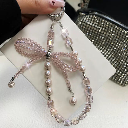 This version positions the product as an ideal gift solution with elegant packaging for special occasions.  Elegant Crystal Bow Phone Chain Gift Set - Luxury Rhinestone Accessory with Detachable Bracelet, Perfect Purse Keychain
