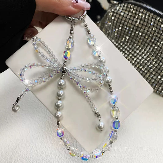 This version positions the product as an ideal gift solution with elegant packaging for special occasions.  Elegant Crystal Bow Phone Chain Gift Set - Luxury Rhinestone Accessory with Detachable Bracelet, Perfect Purse Keychain